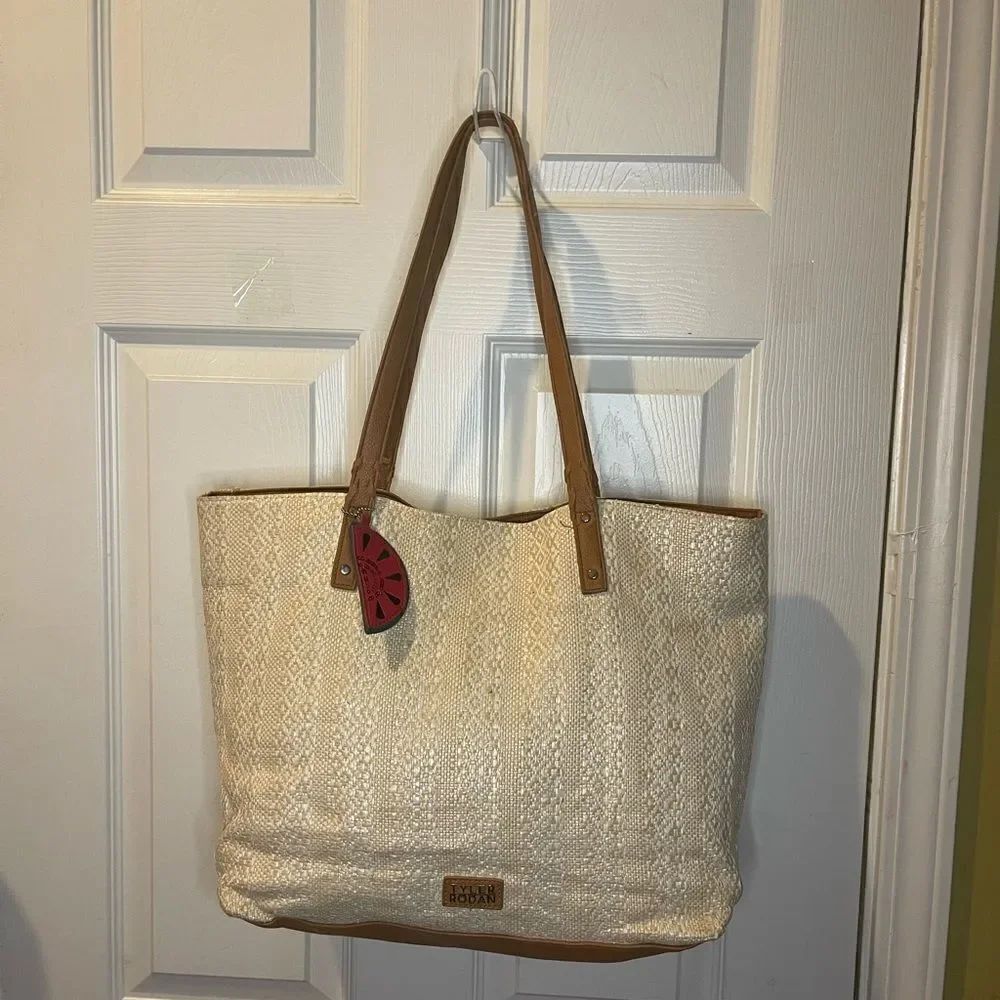 Tyler Rodman beige woven large tote with tan faux leather trim and straps .